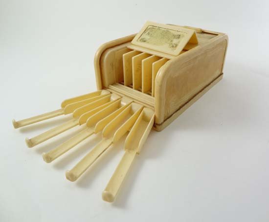 rolinx cigarette dispenser A Rolinx White Bakelite Cigarette Dispenser With Tambou