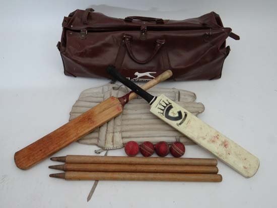 Cricket : a cricket bag containing a crown sports cric: Cricket : a cricket bag containing a crown sports cricket bat , pair of pads , stumps , balls etc. Approx 36" long