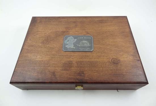A wooden Colt pistol box, possibly originally housing t: A wooden Colt pistol box, possibly originally housing the Colt John Wayne commemorative .45 revolver. Plaque to top of box with image of John Wayne, 'born Winterset Iowa May 26, 1907.' and inscribed '