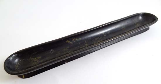 A papier mache pen tray with gilt decoration to sides 1: A papier mache pen tray with gilt decoration to sides 10" long