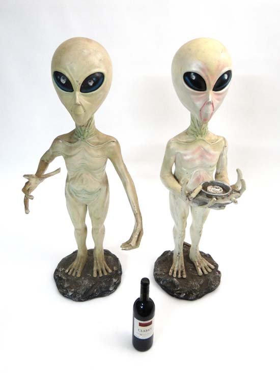 Martians : two floor standing polychromed fibreglass Al: Martians : two floor standing polychromed fibreglass Alien figures, not dis-similar to the aliens in Close Encounters of the Third Kind , standing 38 1/" tall.