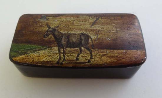 A 19thC German papier-mache snuff box with comical scen: A 19thC German papier-mache snuff box with comical scene to top depicting a mule with an axe hanging over him 2 1/2" wide