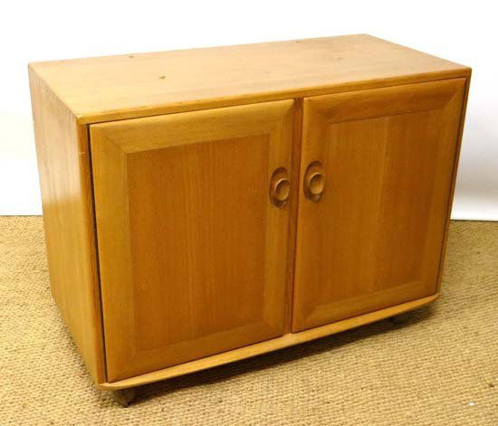 Vintage Retro : Ercol a blonde wood two door basre: Vintage Retro : Ercol a blonde wood two door basre cabinet opening to reveal four division cutlery drawer within and shelves, 36" wide and 27" high.