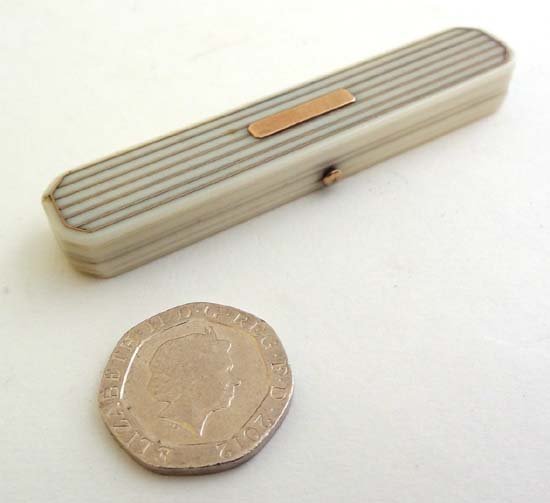 A Georgian ivory toothpick case with rose gold inlay to: A Georgian ivory toothpick case with rose gold inlay to lid opening to reveal mirrored and velvet lined interior 3" long