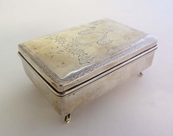 Chinese Export Silver : A late 19thC / early 20thC: Chinese Export Silver : A late 19thC / early 20thC Chinese Export silver rectangular box on four outswept feet with European style engraving to the hinged lid. Marked under WH 90 and Chinese character