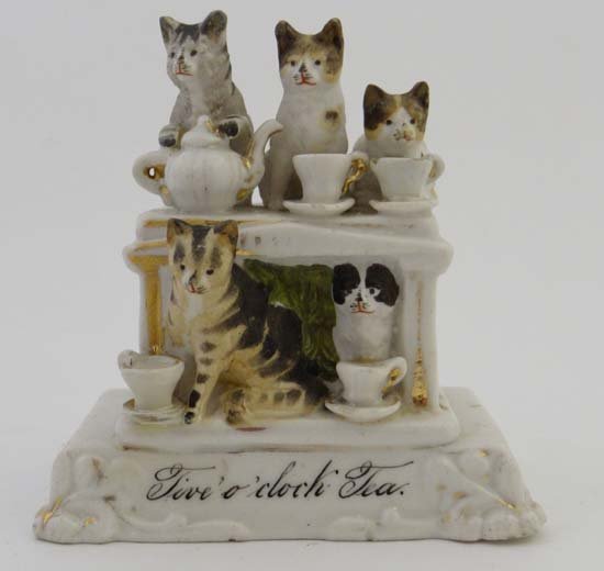 A Conta & Boheme of Possneck, German fairing entitled: A Conta & Boheme of Possneck, German fairing entitled Five O'Clock Tea depicting 3 cats on a table, one with paws around a teapot while 2 cats lap from cups with 2 further cats below the table. 1850-1