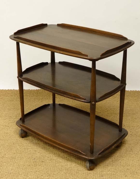 Vintage Retro : Ercol Blue , a three tier dark serving : Vintage Retro : Ercol Blue , a three tier dark serving trolley ( model 458?) standing on castors, 26 1/4" long £30 - 40