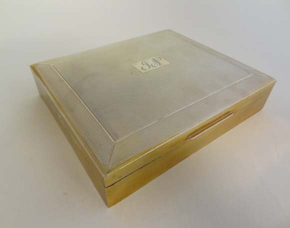 A HM silver table top cigarette case with engine turned: A HM silver table top cigarette case with engine turned decoration and wood lined interior. Birmingham 1955 maker Harman Brothers 6 1/2" x 5 1/2" x 1 1/4" £150 - 200