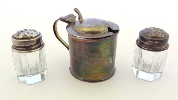 A HM silver mustard pot Sheffield 1916 maker Atkin Brot: A HM silver mustard pot Sheffield 1916 maker Atkin Brothers together with a pair of French glass and silver plate pepperettes by Orfevrerie Ercuis £50 - 80