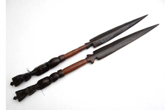 Native Tribal : a pair of African carved wooden short: Native Tribal : a pair of African carved wooden short spears. £15 - 25