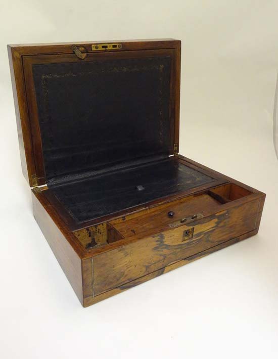A 19thC Rosewood writing box / lap desk with pewter: A 19thC Rosewood writing box / lap desk with pewter and mother of pearl inlay opening to reveal gold tooled blue leathered slope , the reverse having 'Speak Gently ' and the ' Christians Home ' songs 