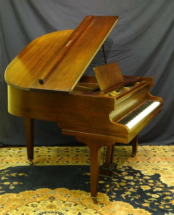 A German baby grand piano by Steinbach , of laminated: A German baby grand piano by Steinbach , of laminated construction with 7 octave keyboard, sustain and damper pedals, cast iron plate & spruce soundboard. 52" long, 52" wide, 38" tall. £400 - 600