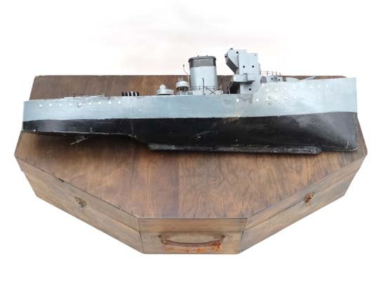 A Scratch Built model of a WWII MTV motors torpedo: A Scratch Built model of a WWII MTV motors torpedo vessel, three vessel turrets, forward facing naval canon and two anti aircraft turrets, to include a large purpose built case. Height 11" 36" wide. P