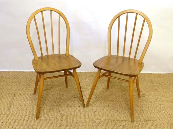 Vintage Retro : Ercol blue , stamped 1960 under , a: Vintage Retro : Ercol blue , stamped 1960 under , a pair of Blonde wood Windsor Kitchen Chairs no. 400 . 34" high Please Note - Prospective purchasers must satisfy themselves as to the condition of lo