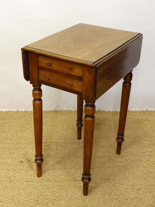 A 19thC mahogany Pembroke style small work table with 2: A 19thC mahogany Pembroke style small work table with 2 drawers to one end 14" deep x 18 1/4" wide x 27 1/4" high Please Note - Prospective purchasers must satisfy themselves as to the condition of lo