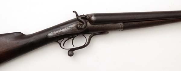 Shotgun : An Army & Navy CSL, London K Quality 12 bore: Shotgun : An Army & Navy CSL, London K Quality 12 bore back action rotary under lever hammer gun, serial number 41785. 16" straight hand walnut stock with vacant escutcheon and horn butt plate. 30" st