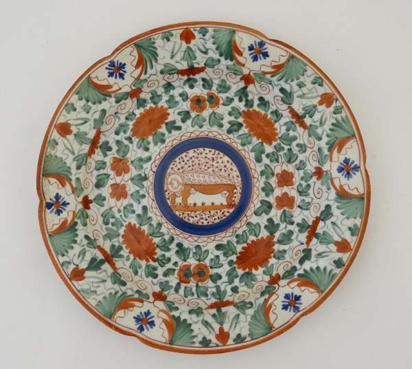 Creamware ? : an 18th / 19thC plate with hand painted: Creamware ? : an 18th / 19thC plate with hand painted decoration, possibly New Hall. 9 1/2" diameter £30 - 50