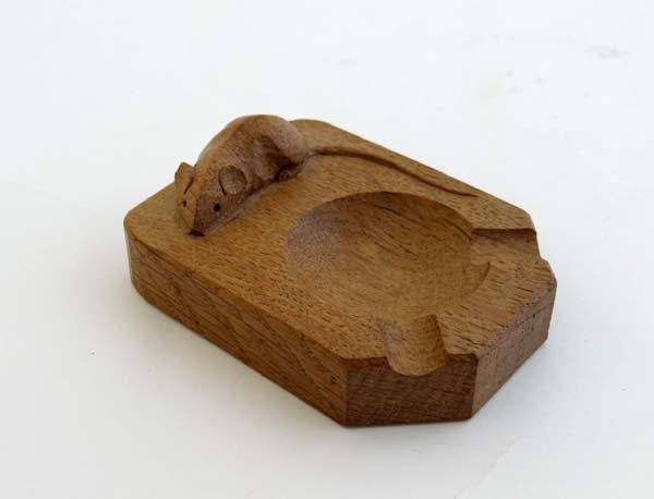 Robert ' Mouseman ' Thompson : A carved oak ashtray: Robert ' Mouseman ' Thompson : A carved oak ashtray with mouse upon 3 7/8" long £25 - 35