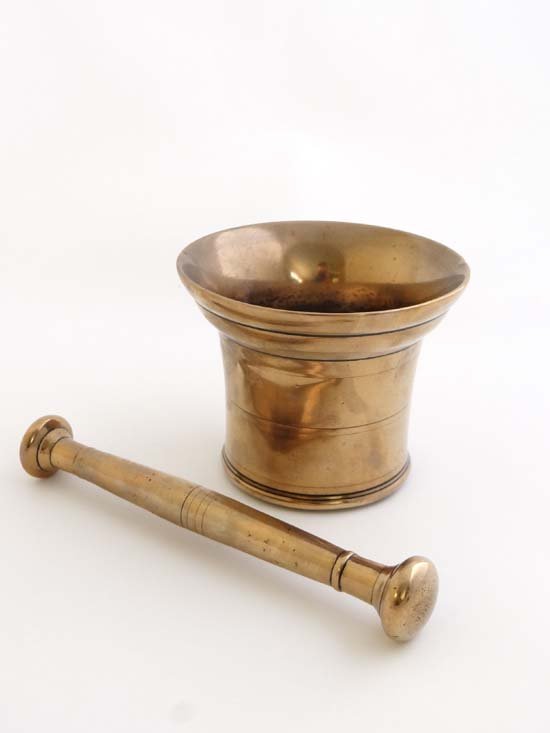 A 17thC bell metal mortar and pestle . the mortar 4: A 17thC bell metal mortar and pestle . the mortar 4 1/8" high £40 - 50