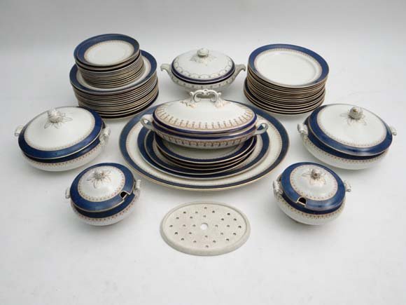 Bishop Ivory Dinner Service : A part service comprising: Bishop Ivory Dinner Service : A part service comprising five graduated oval meat plates and small drainer , four lidded service bowls , twelve side plates , 10 + 12 dinner plates and seven soup bowls 