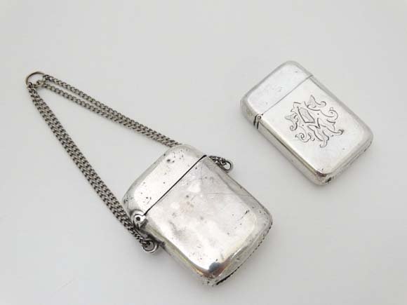 A Victorian HM silver vesta with hinged lid and striker: A Victorian HM silver vesta with hinged lid and striker under London 1881 maker Thomas Johnson together with another indistinctly marked (2) Please Note - we do not make reference to the condition of