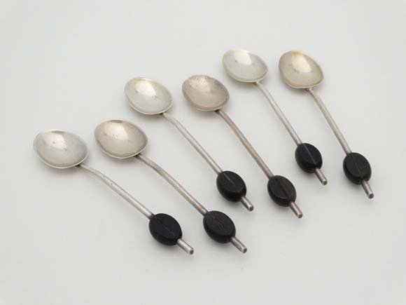 A set of 6 silver coffee spoons with ebonised coffee: A set of 6 silver coffee spoons with ebonised coffee bead decoration to handles. Hallmarked Birmingham 1912 maker S W Smith & c) Please Note - we do not make reference to the condition of lots within