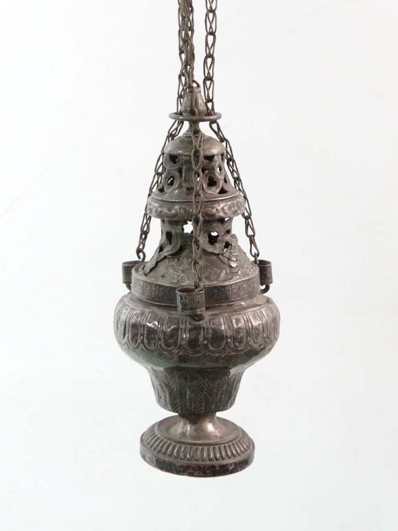 An early 19thC baluster shaded white metal and plate: An early 19thC baluster shaded white metal and plate brass incense sensor with leaf motif, having 4 hanging chains the whole 44" long Please Note - we do not make reference to the condition of lots wi