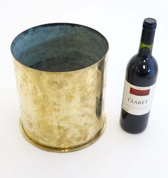 WWI : A highly polished large trenchart brass German: WWI : A highly polished large trenchart brass German Howitzer shell case, marked ' RhMF 39 Duseldorf Juli 1916 ' underside 9 1/2" high