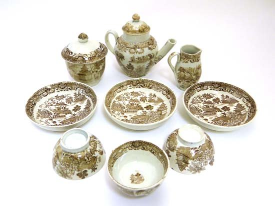 A c 1800 miniature pearlware tea service decorated with: A c 1800 miniature pearlware tea service decorated with brown transfer printed variation of Willow Pattern, comprising tea pot and cover, jug, covered circular sugar bowl and three cups and saucers to