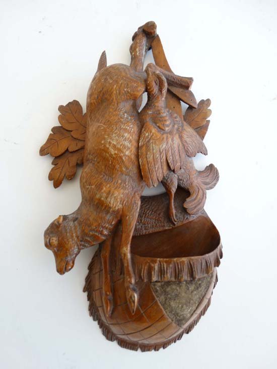 Black Forest : A carved wooden wall pocket in the form: Black Forest : A carved wooden wall pocket in the form of a game hunter's bag with capercaillie and chamois 9" long