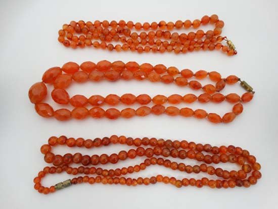 3 various carnelian bead necklaces including a 2 strand: 3 various carnelian bead necklaces including a 2 strand necklace of graduated facet cut beads