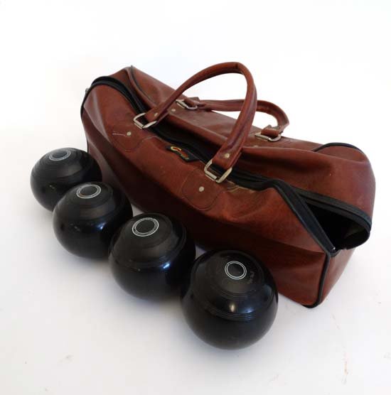 Lawn bowls : A set of four Scottish ' Lignoid ' bowls: Lawn bowls : A set of four Scottish ' Lignoid ' bowls by Thomas Taylor , in a leather case by Karbobes , together with a Terry measure Please Note - we do not make reference to the condition of lots w