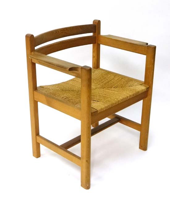 Vintage Retro : Børge Mogensen for Karl Andersson,: Vintage Retro : Børge Mogensen for Karl Andersson, Husqvarna, Sweden. A 1960's pine and envelope seagrass seated open armchair with arm rests . Bears ' Karl Andersson ' brand mark under . 29" high Pl
