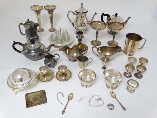 A quantity of assorted silver plate wares to include: A quantity of assorted silver plate wares to include part tea sets, vases etc Please Note - we do not make reference to the condition of lots within catalogue descriptions. We are however happy to pro