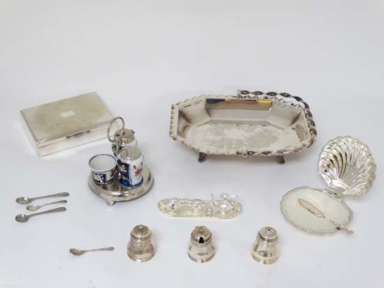 Assorted silver plated wares to include a cake basket,: Assorted silver plated wares to include a cake basket, b utter dish, dolls miniature tea set , cigarette box, cruet set etc Please Note - we do not make reference to the condition of lots within catal