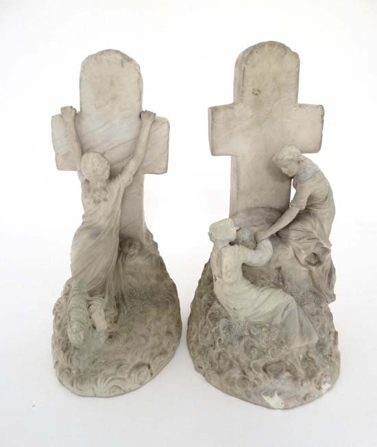 A Victorian bisque porcelain funereal altar ornaments: A Victorian bisque porcelain funereal altar ornaments of young girl clutching a cross together with another of a girl being comforted at the base of a cross. 11" high Please Note - we do not make refe