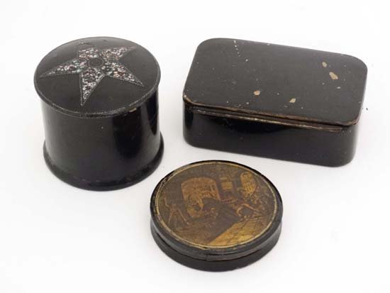 An early 19thC circular table snuff box with Hogarth: An early 19thC circular table snuff box with Hogarth type scene to lid, an early 20thC papier-mache circular pot and cover with abalone shell star formed inlay and a papier-mâché table snuff box. La