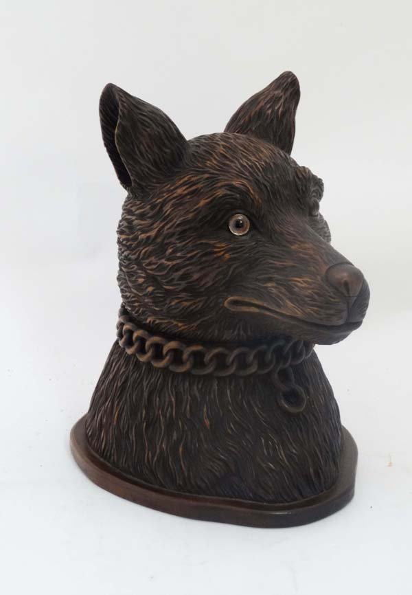 Black Forest : An unusual Contemporary carved box in: Black Forest : An unusual Contemporary carved box in the form of an articulated dogs head with chain collar and glass eyes, and hinging at neck. A one off piece. 12 3/4" high Please Note - we do not m