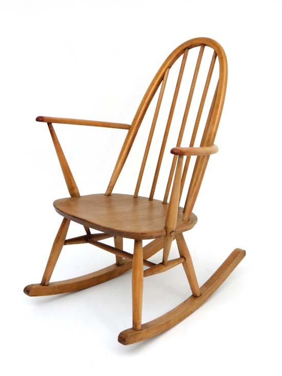 Vintage Retro : a British Ercol 1960 elm and beech (: Vintage Retro : a British Ercol 1960 elm and beech ( blonde) Windsor Fireside rocking chair , on bows , known as ' Quaker Rocking Chair 428 ' , stamped under with remains of label verso, 33 3/4" high