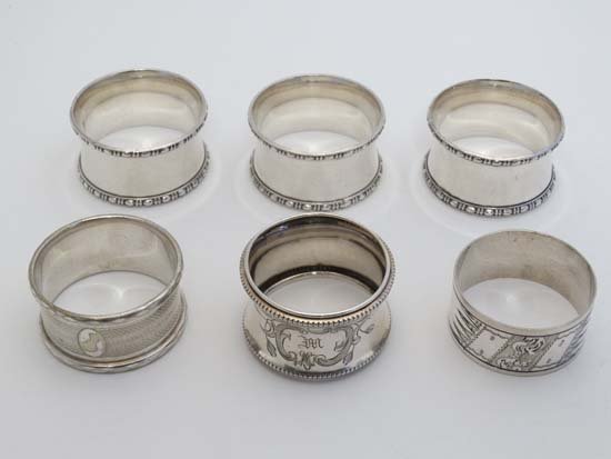 5 various silver plate napkin rings together with a: 5 various silver plate napkin rings together with a .800 German silver napkin ring (6)