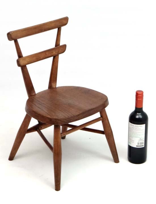 Vintage Retro : a British Ercol Windsor Stacking Chair: Vintage Retro : a British Ercol Windsor Stacking Chair ( child's?) circa 1962 with second vertical splat ( no. 465 ) standing 21" high. Please Note - we do not make reference to the condition of lots