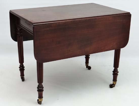 Manner of Gillows : a c1835 Pembroke table with: Manner of Gillows : a c1835 Pembroke table with gadrooned legs , brass cup casters, reeded edges and drawer to one end, 36" long x 24 1/4" wide ( when folded) . For similar leg see page 247 , Gillows