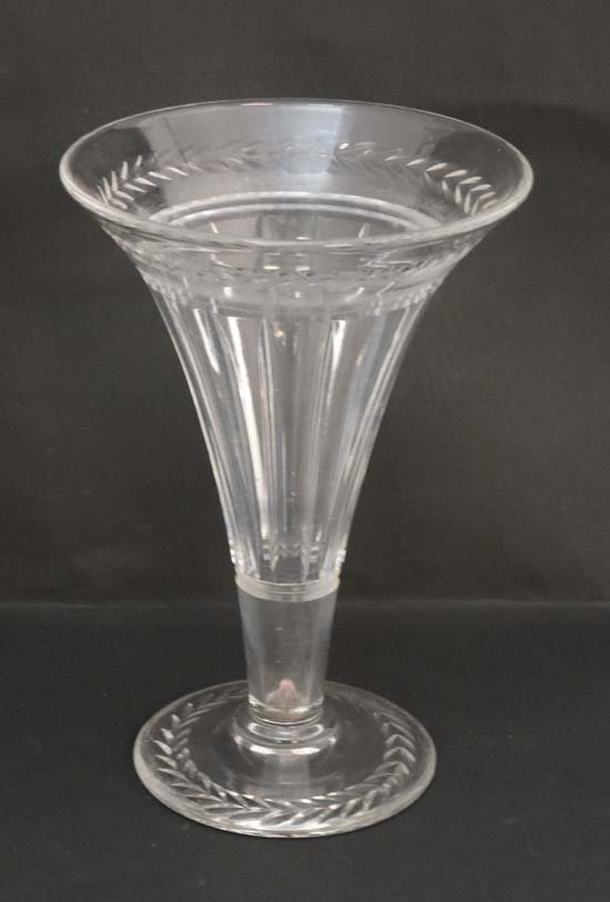Stuart crystal : A cut glass pedestal vase of flared: Stuart crystal : A cut glass pedestal vase of flared form. Marked Stuart under. 9 1/4" high. £20 - 30