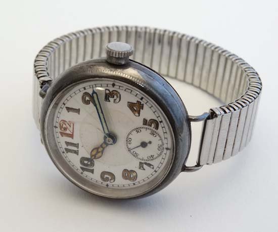 Wrist Watch : A .925 Silver cased early XX Swiss: Wrist Watch : A .925 Silver cased early XX Swiss Gentleman's wristwatch with 17 Jewel movement , stepped white enamel dial with red 12 and seconds dial at 6 with luminous Arabic hour markers and hands