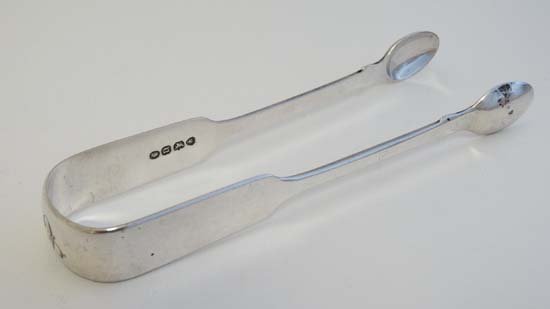 William IV Silver fiddle pattern sugar tongs hallmarked: William IV Silver fiddle pattern sugar tongs hallmarked London of silver fiddle pattern sugar tongs hallmarked London 1835 maker Mary Chawner 5 3/4" long (52g)