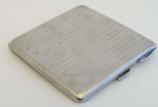 A silver cigarette case  with engine turned decoration (1 of 5)