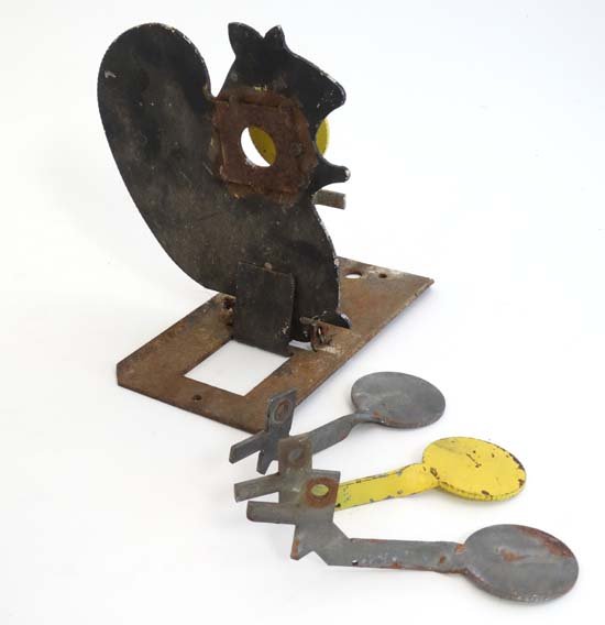 Shooting : A metal knock - down target formed as a: Shooting : A metal knock - down target formed as a squirrel , having three spare circular targets . Approximately 9'' tall