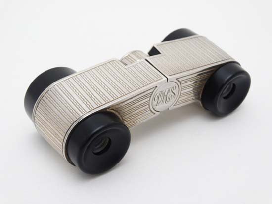 Asprey : A pair of theatre / opera glasses with: Asprey : A pair of theatre / opera glasses with engraved decoration to the central silver section. Hallmarked London 1985 maker Asprey & Co Ltd. 4'' wide