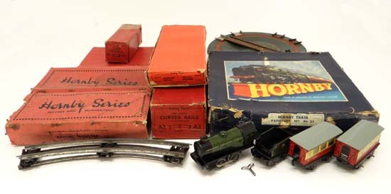 A Hornby O gauge clockwork passenger train set, number: A Hornby O gauge clockwork passenger train set, number 21 , in original box, to include engine, coal car , 2 x passenger cars, a quantity of connection plates and a selection of track. Together with H