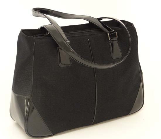 A Genuine Ladies DKNY black weekend bag. Approx 11'': A Genuine Ladies DKNY black weekend bag. Approx 11'' high x 16'' deep x 5'' wide (excluding handles).